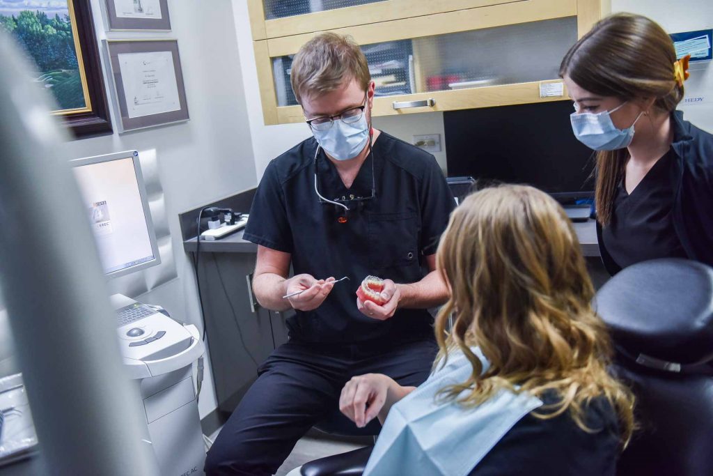 Dr. Keaton Colville with Patient | Core Dental | General & Family Dentist | Downtown Calgary