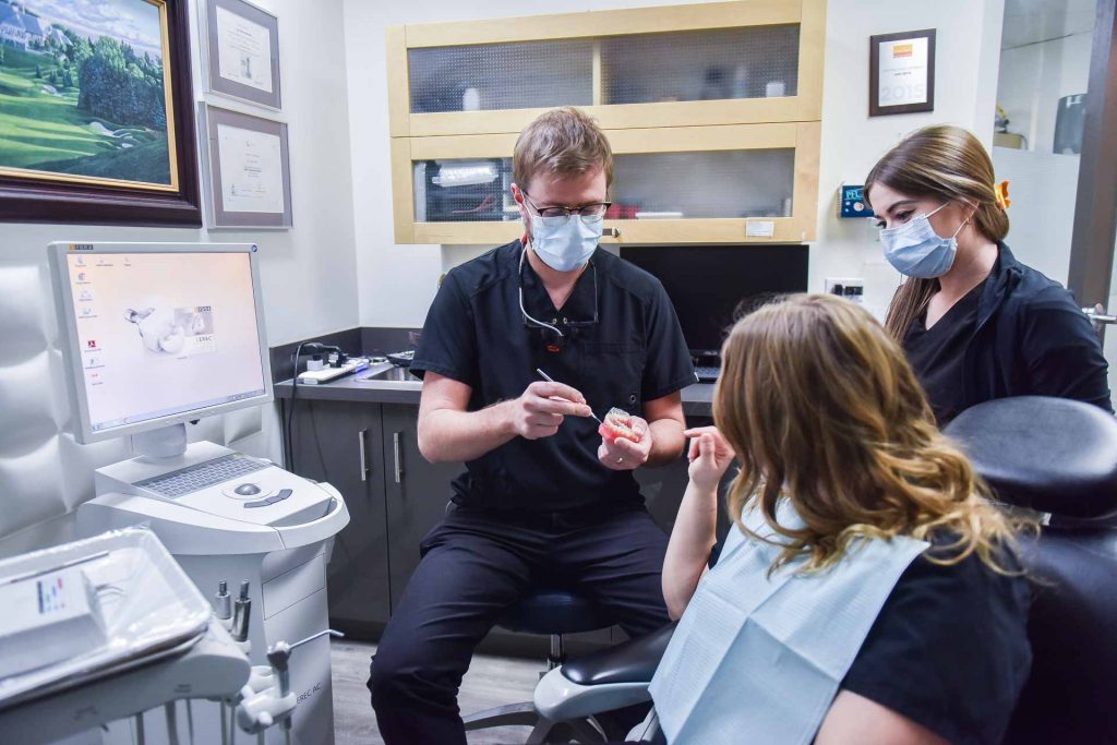 Dr. Keaton Colville with Patient | Core Dental | General & Family Dentist | Downtown Calgary